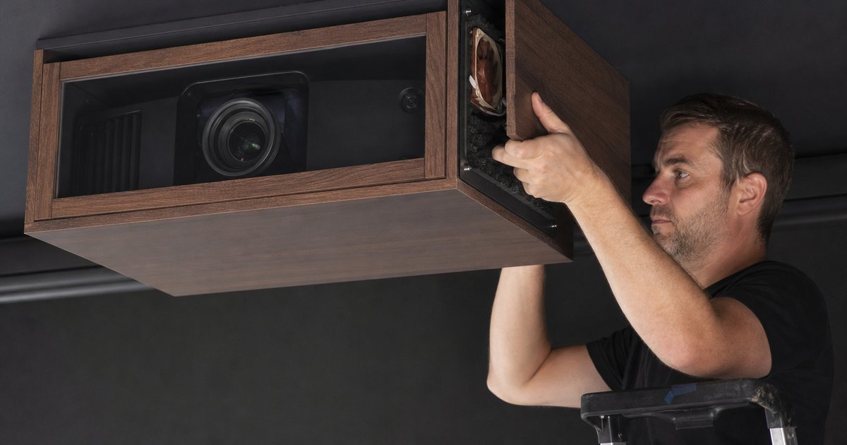 What should a homeowner do when the projector fan is audible from the seats?