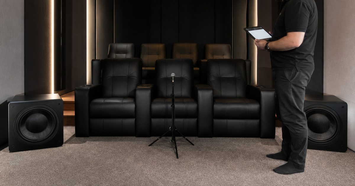 How many subwoofers does a dedicated cinema room need for smooth, even bass?